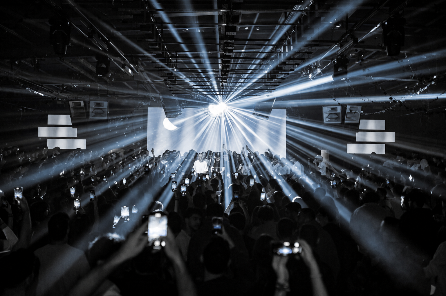 :DARREN performing to a packed club crowd under blue lasers
